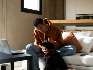 man pets old dog lovingly for Oncotect, a new cancer screening test for dogs