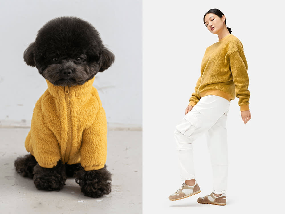 an orange fleece jacket, a tan fleece jacket with a red scarf