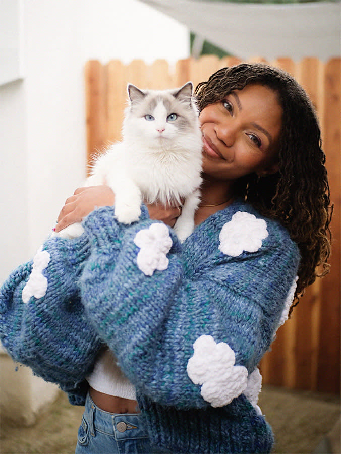 Leah Thomas with her white cat