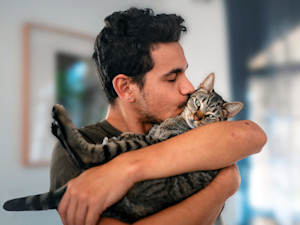 Man holding his cat.