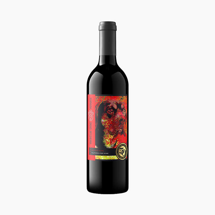 dog on a bottle of red wine