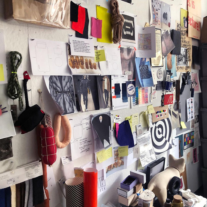 a dog atop a pile of Mr. Dog dog beds
