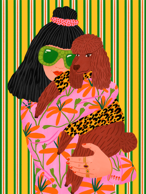 A woman with black hair and green sunglasses hugs her brown Doodle dog