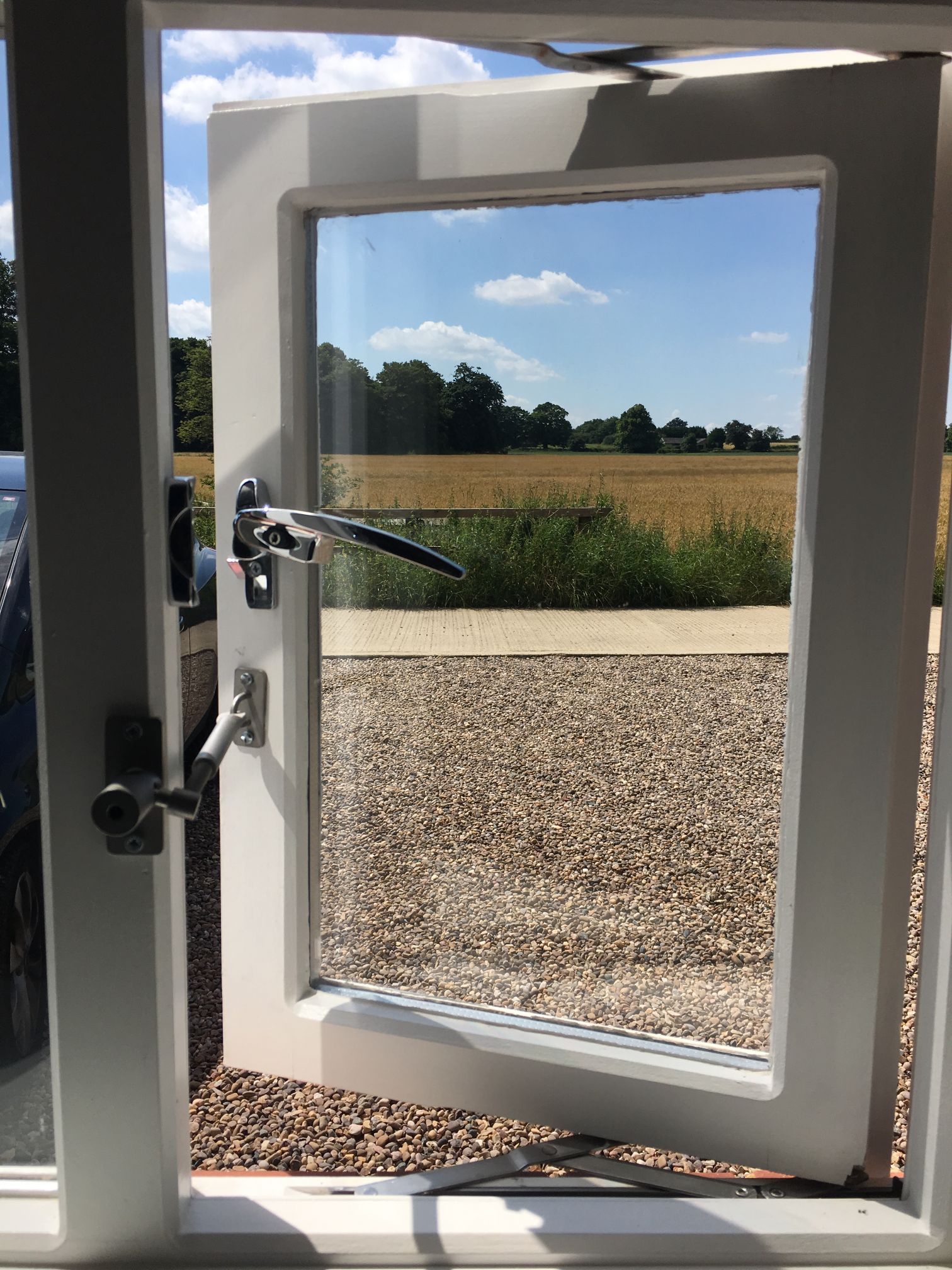 window overlooking a meadow with a window lock on