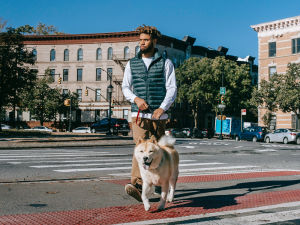 Man walking his dog in the city