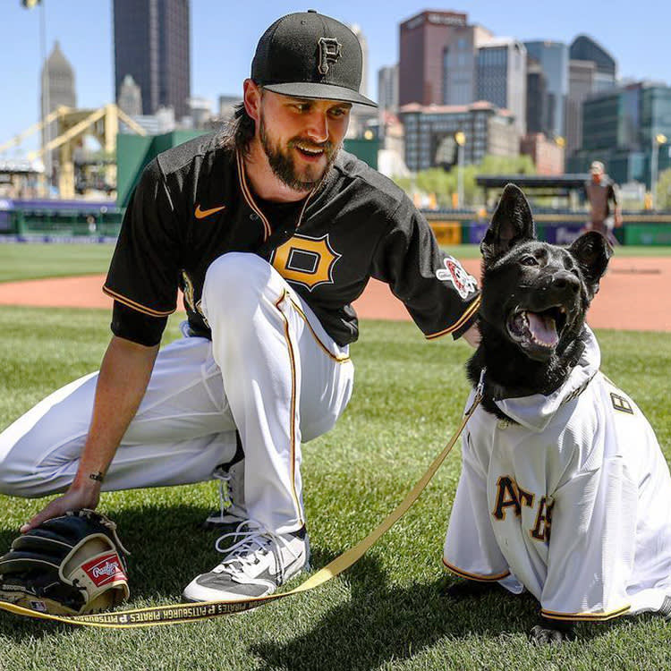 JT Brubaker from the Pittsburgh Pirates and Bucco the dog.