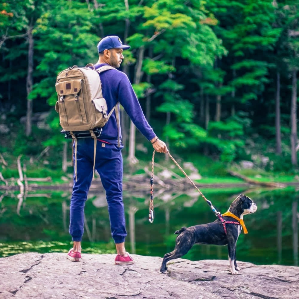 Steven Rojas and his dog, Zelda, by a lake