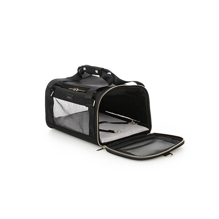 the pet carrier in black with a shearling bed