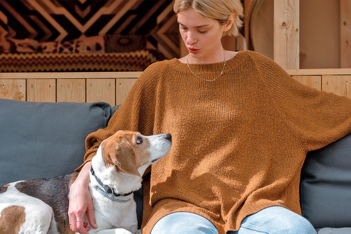 person sitting with a dog
