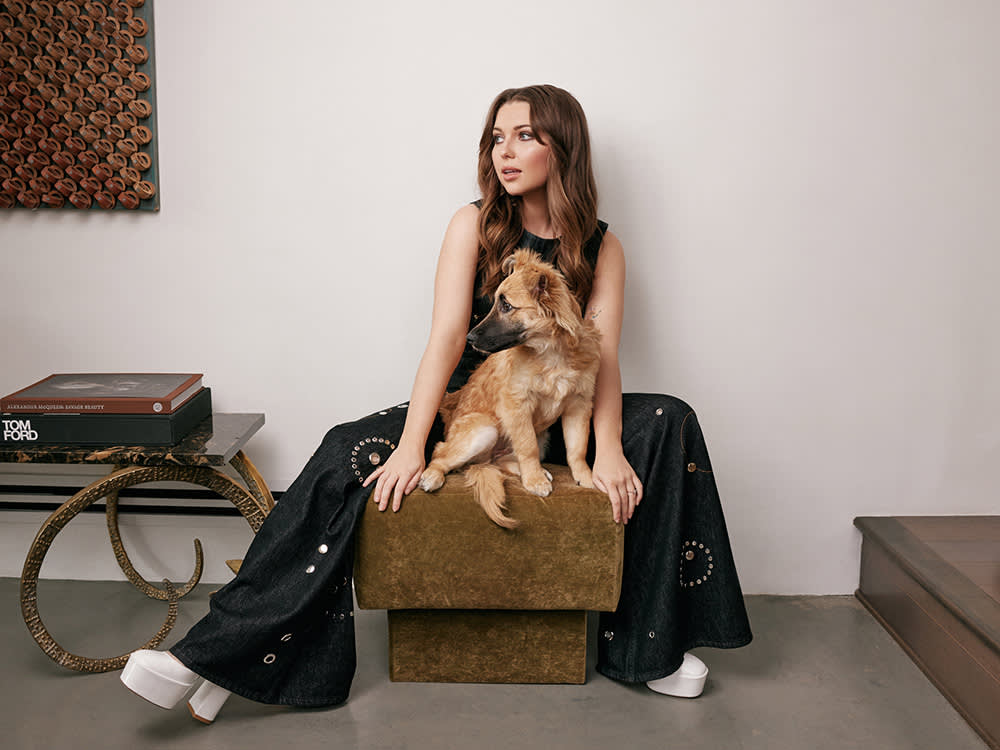 Samantha Hanratty sitting with her dog