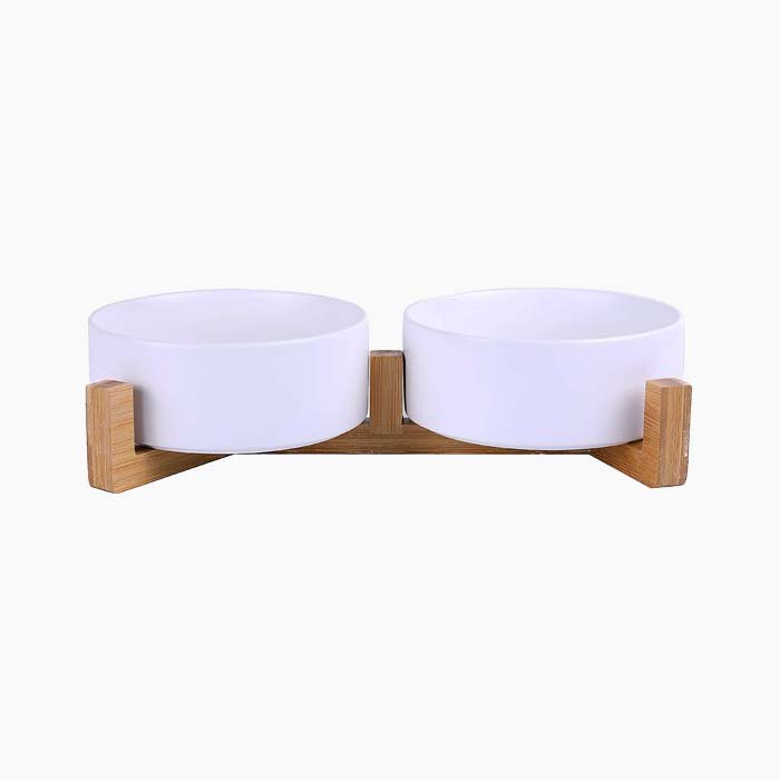 the two cat bowls on a wood stand