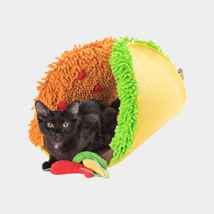 taco bed with a black cat sitting in it
