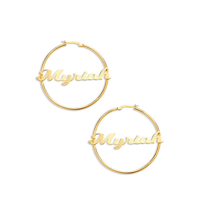 gold nameplate earrings that read "Myriah"