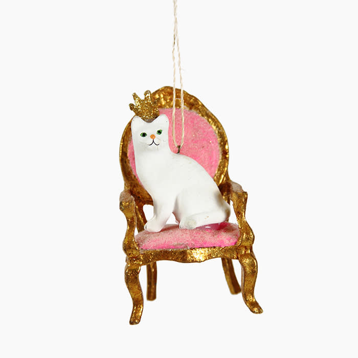 white cat on pink and gold chair