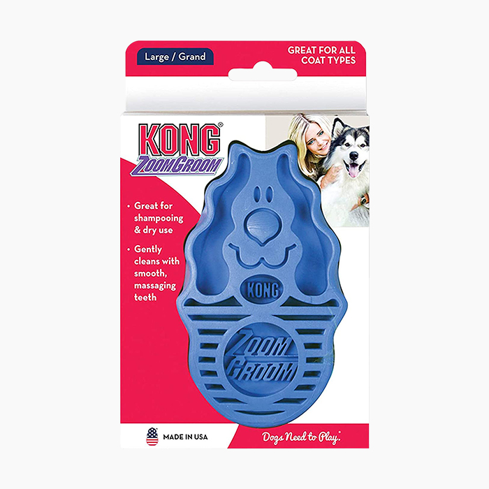 blue kong grooming brush in red packaging