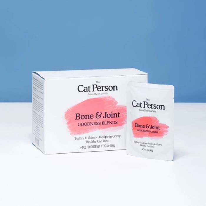 the cat person supplement in white and pink package