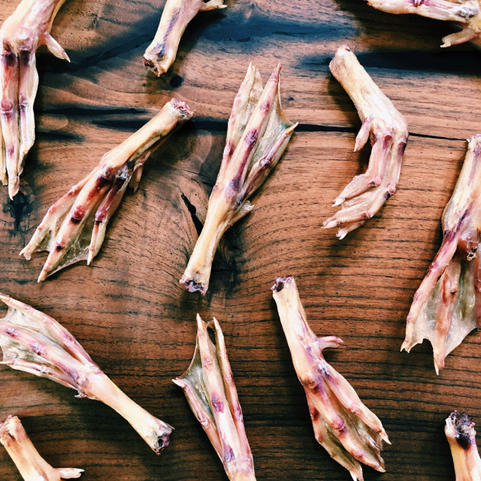 duck feet on cutting board
