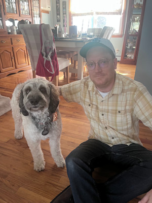 Timothy Baker poses with his dog
