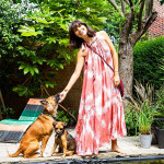Jasmine Hemsley standing with her two dogs