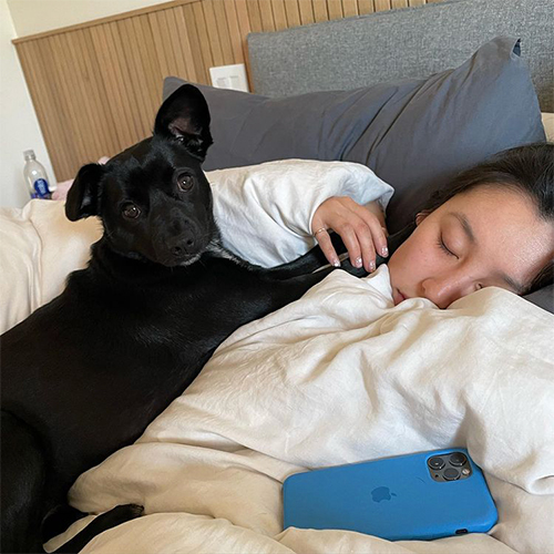 olivia sui snuggling with puppy grizzly