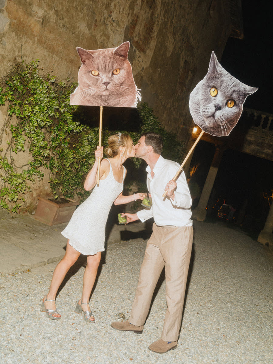 Couple at a wedding with cat heads
