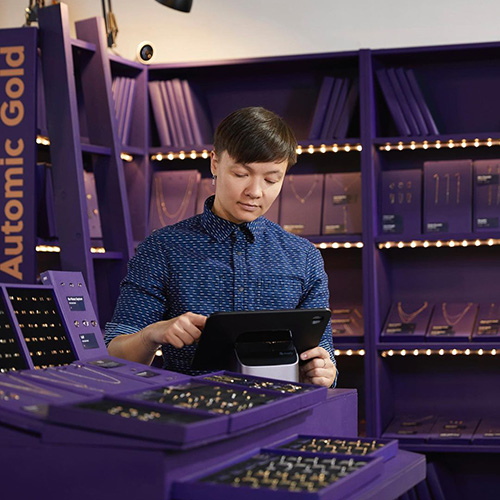 jeweler in a purple room