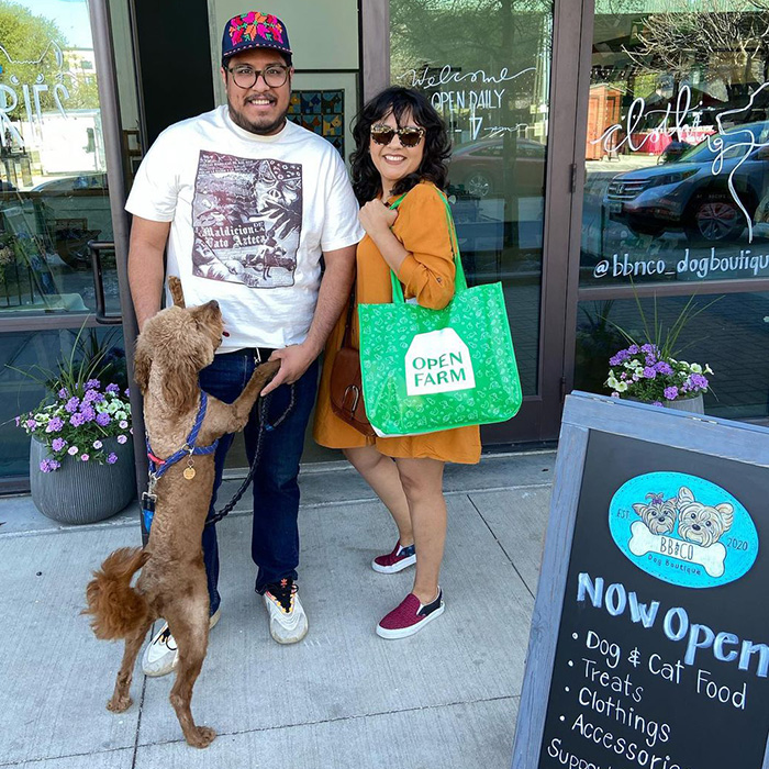 a small brown dog outside BB & Co
