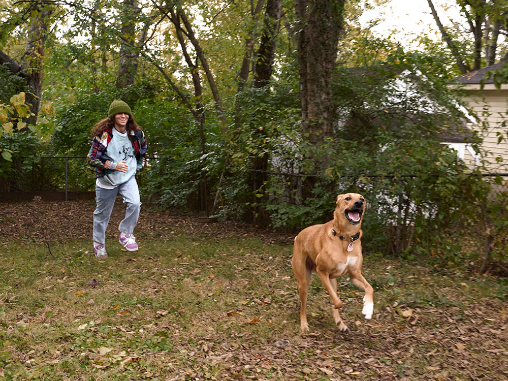 Briston Maroney and his dog running outdoors