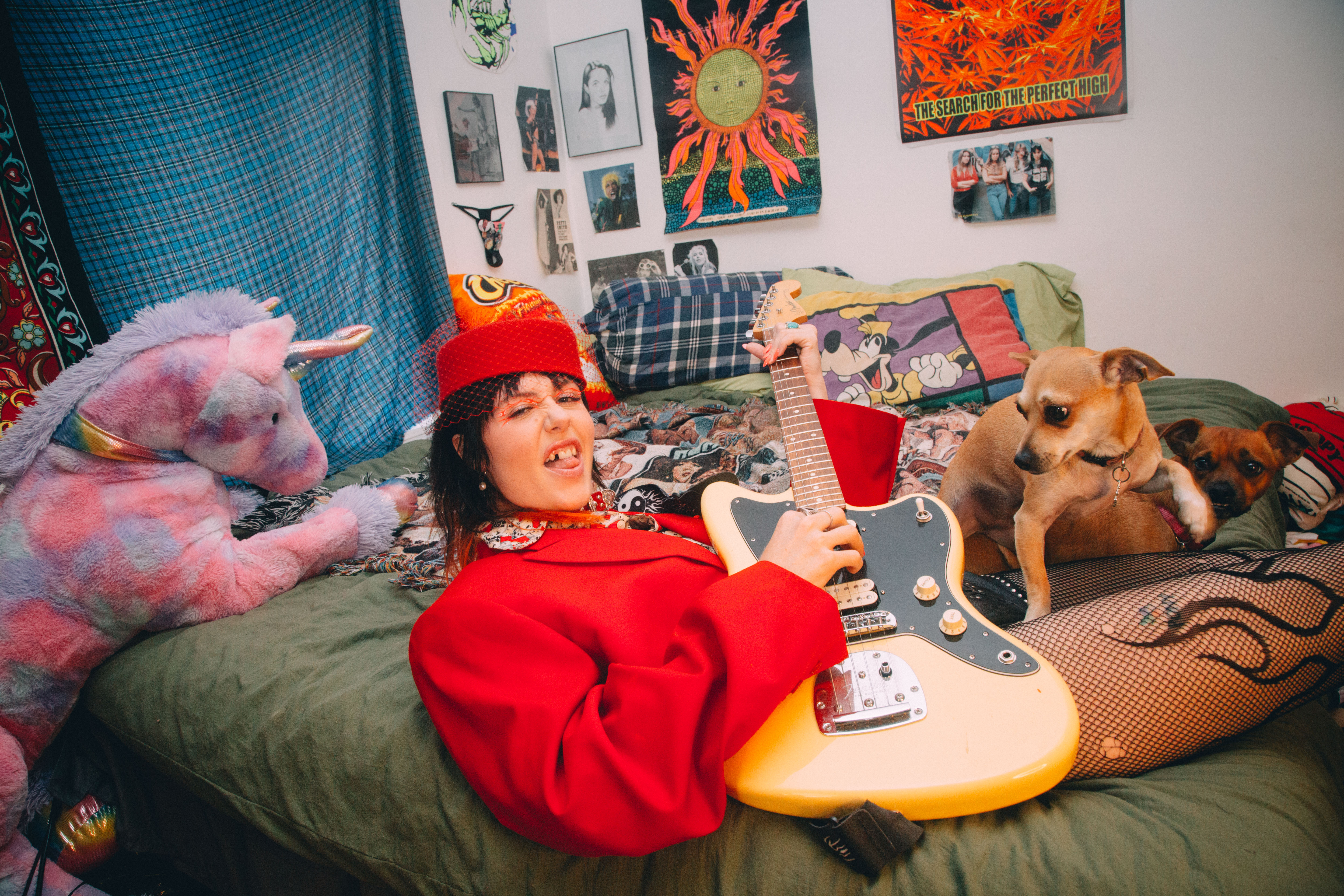 Dani Miller playing guitar with her dog