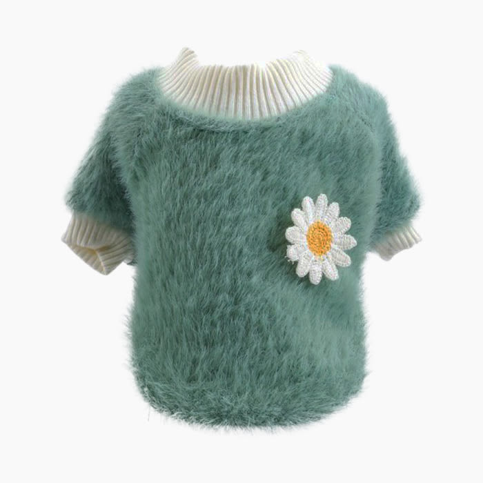 fuzzy green sweater with white flower