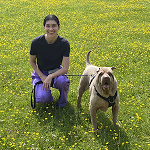 woman with a shar pei dog