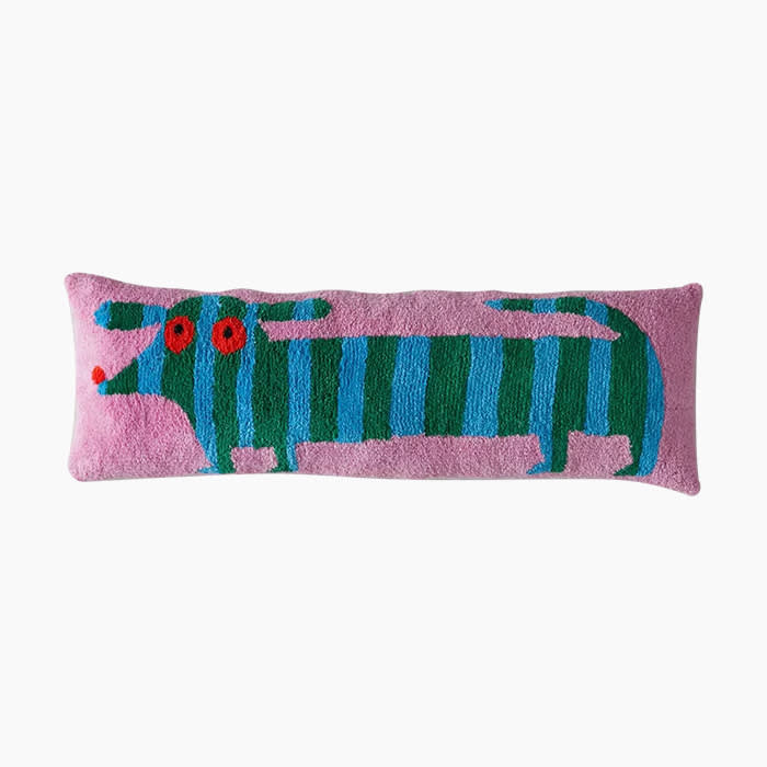 long pink and blue pillow with dog design