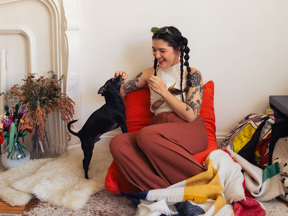 Arabelle Sicardi plays with their dog, Titan