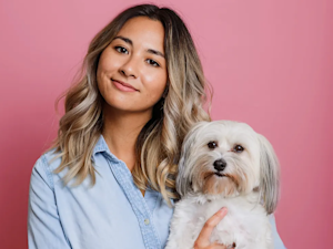 Mia Mercado with her small white dog