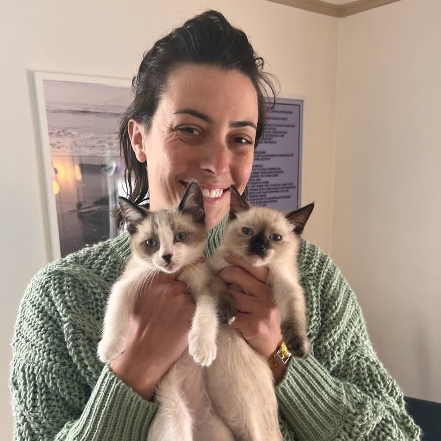 Kari Paul holding two kittens