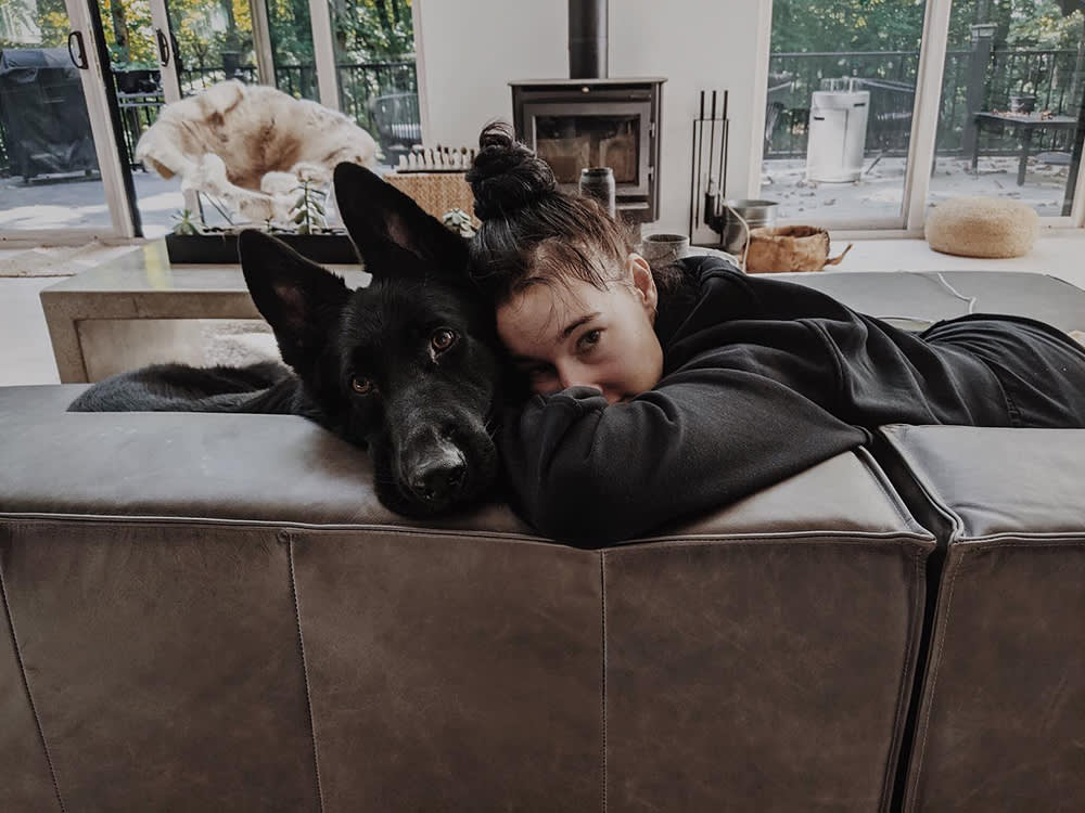 Zola Jesus with her large black dog