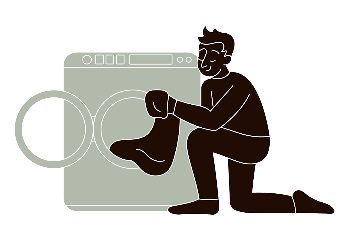 pet parent washing clothes in the laundry machine