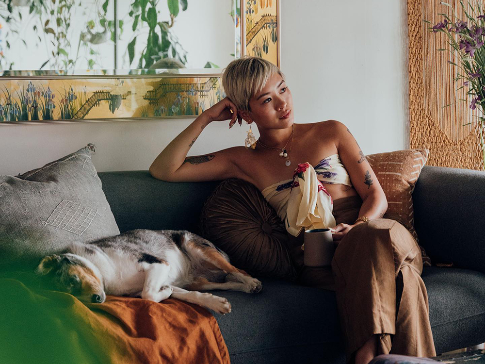 Jess Tran and her dog on a couch