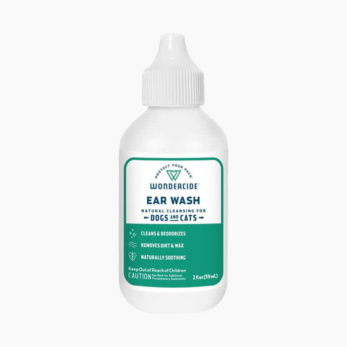 ear wash for pets in white bottle with green label