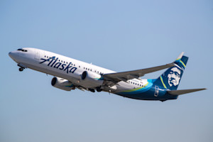 Alaska Airlines plane flying in the air