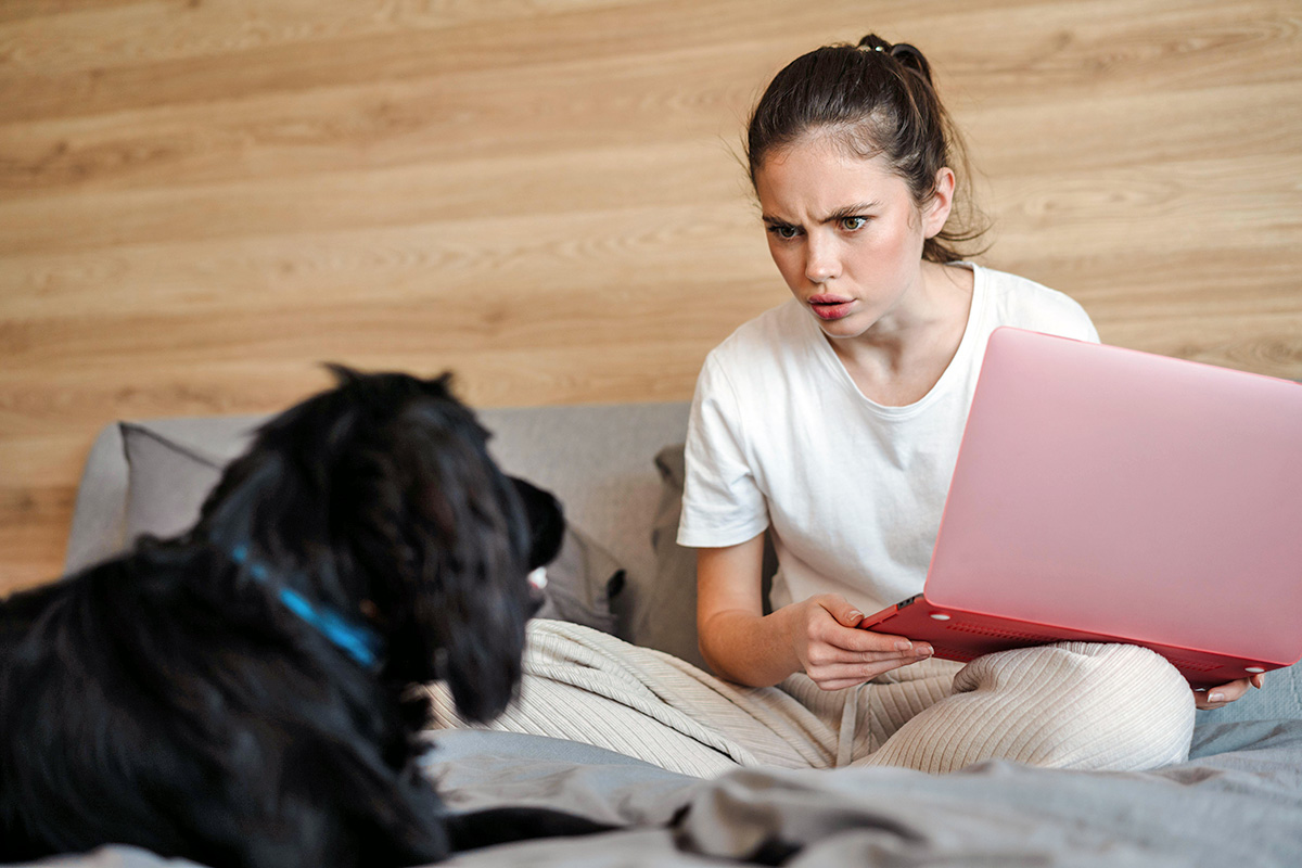 person looking sternly at a dog