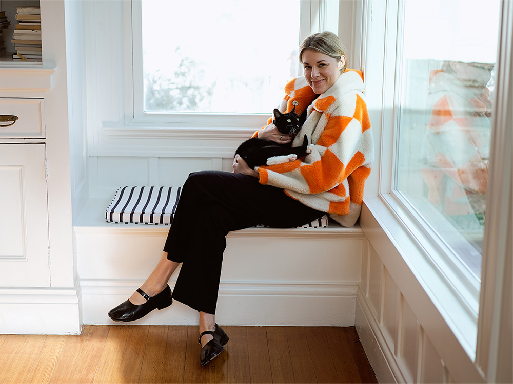 Lisa Buhler with her black and white cat