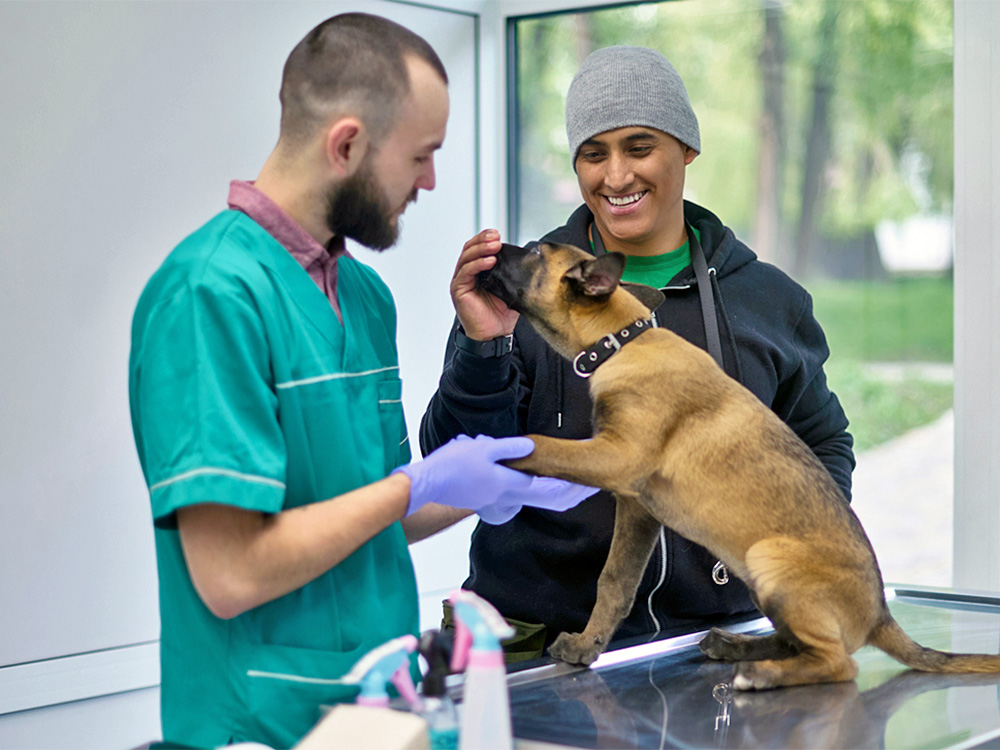 Man and his pet at the vet's office.