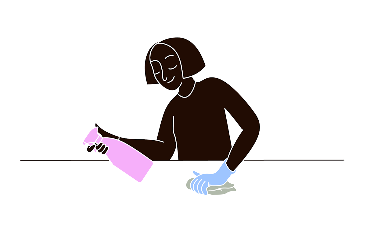 pet parent cleaning up the surface after cat anal gland expression