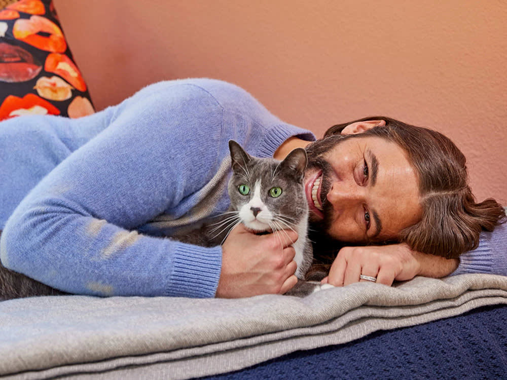 jonathan van ness poses with their cat