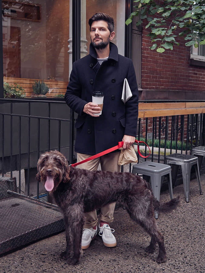 Adam Scott and large brown dog.