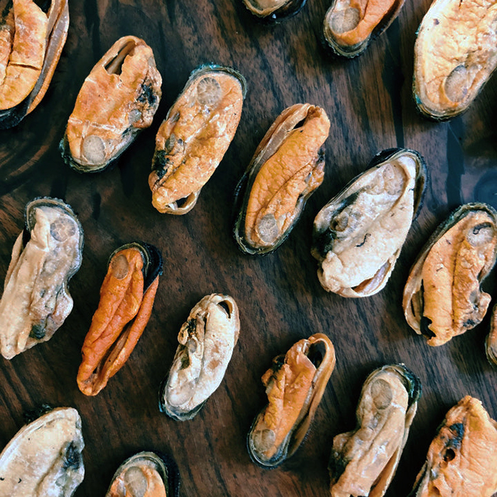 mussels on a wood cutting board