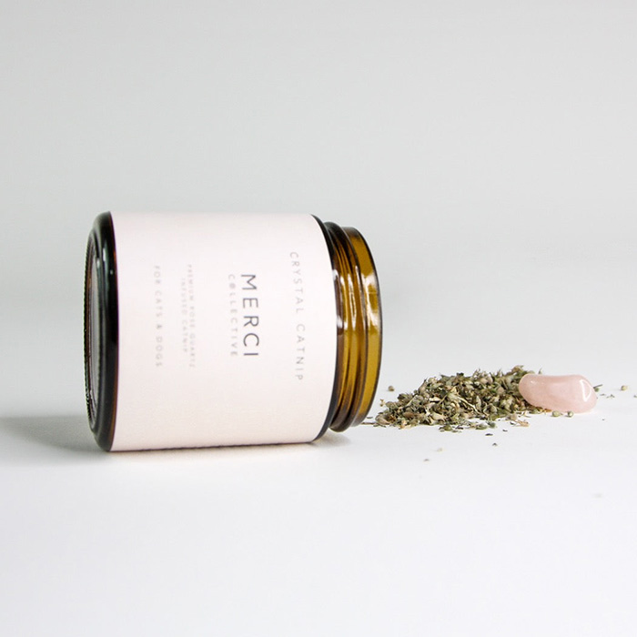 crystal catnip for dogs in glass container with pink label