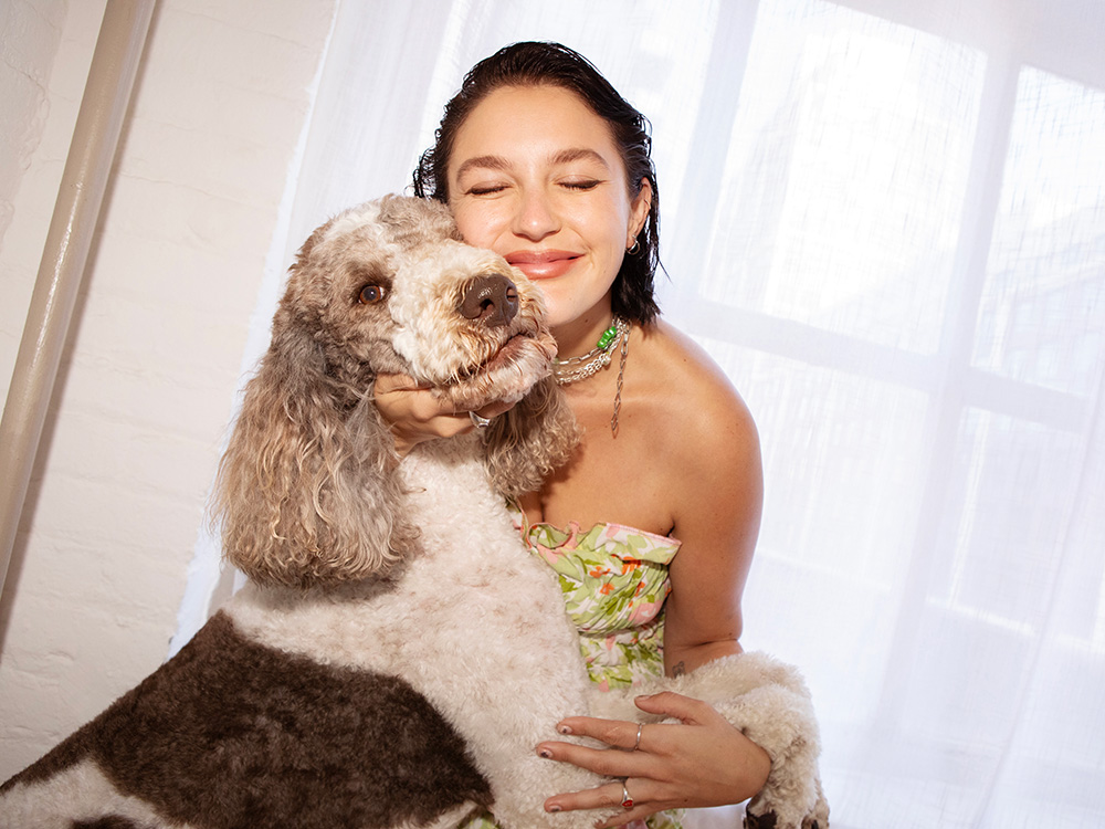 Gracie McGraw hugging her dog