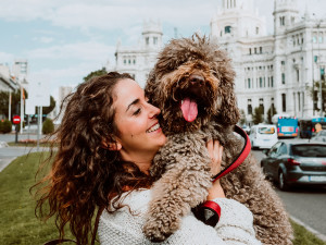 dog and woman exploring a new town